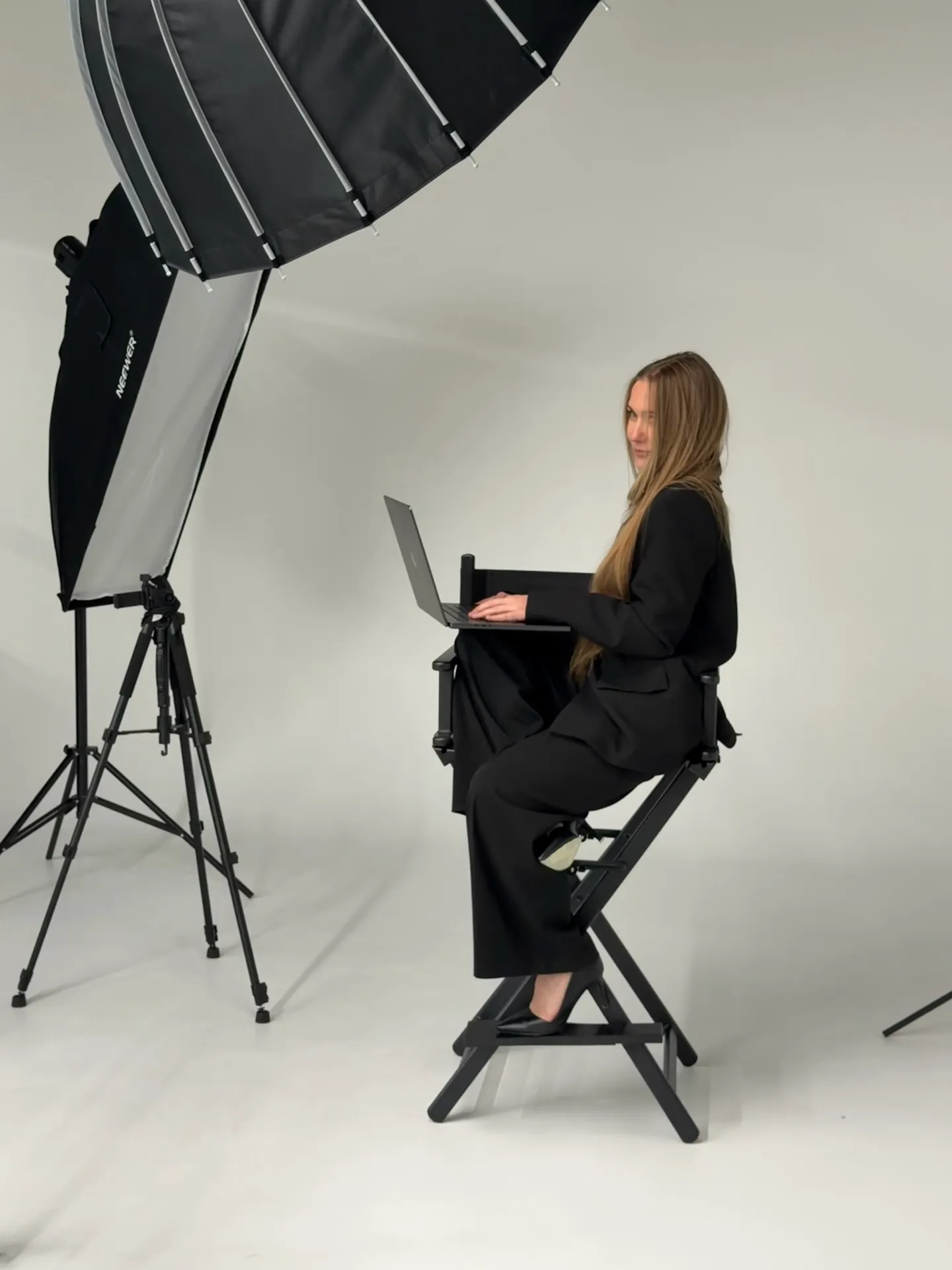 Film UA studio near Denver: director's chair, softbox lighting and a laptop for on-set review